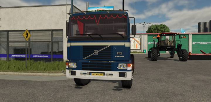 fs25-mods, Farming Simulator 25 mod featuring a classic blue Volvo F12 truck with decorative interior, parked in a farm equipment lot.