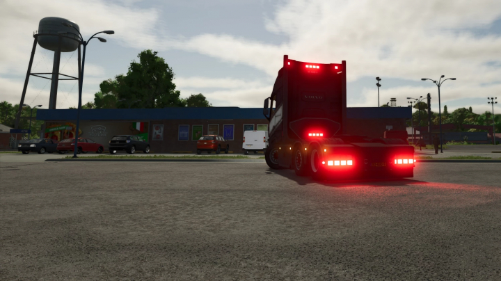 fs25-mods, In Farming Simulator 25, a dark Volvo FH16 truck with illuminated taillights is parked on a city street at dusk.