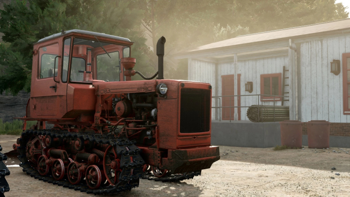 fs25-mods, Farming Simulator 25 mod featuring the DT-75 v1.0.0.0 tractor with tracks, parked outside a farm building in the game.