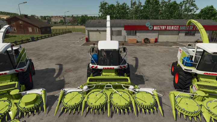 fs25-mods, Farming Simulator 25 mods: Front view of a CLAAS Jaguar 800 Series silage harvester with green equipment, parked in front of a farm building.