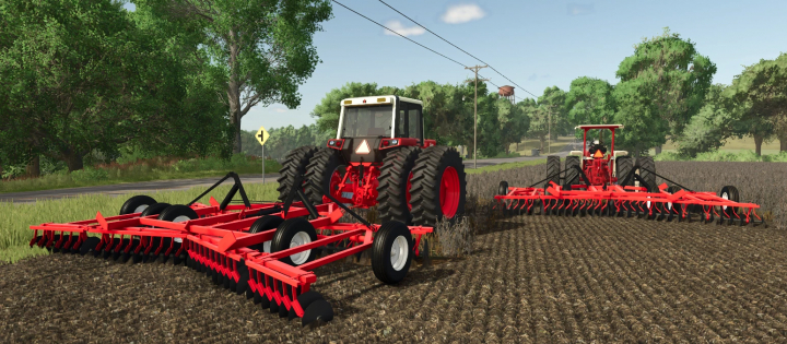 fs25-mods, Farming Simulator 25 mods: FS25 International Harvester 20ft 490 disk with red farm equipment attached to a tractor, working on a farm field.