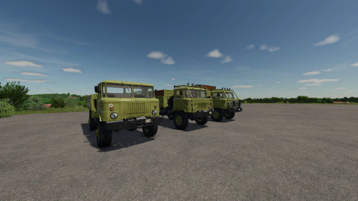 fs25-mods,  Farming Simulator 25 mods: GAZ 66 Pack v1.0.0.0 trucks in a row on a gravel field under a blue sky.