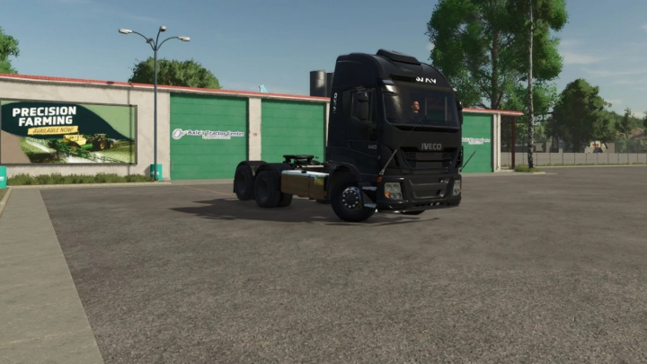 fs25-mods, Farming Simulator 25 mod: Black Iveco 440 Edit BR truck in a parking lot with branding on the wall.