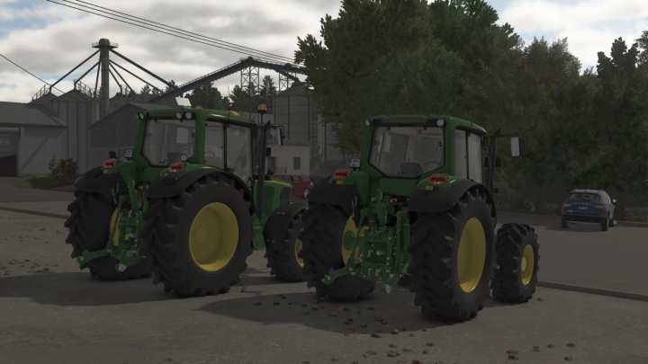 fs25-mods, Two John Deere 6020 Premium Series 4-cylinder tractors in Farming Simulator 25, parked outdoors with industrial buildings in the background.