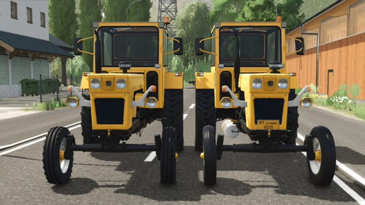 fs25-mods, Farming Simulator 25 mod: two yellow UTB Universal 650 BGC tractors from FS25 mods, front view on village street.