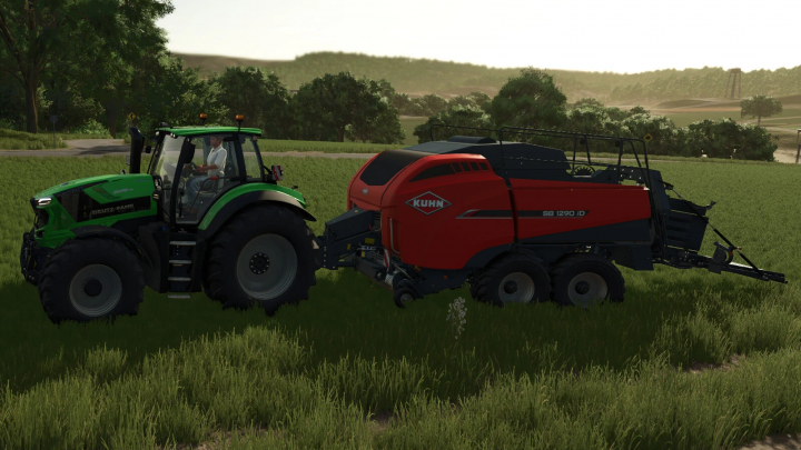 fs25-mods,  Farming Simulator 25 mod: Green Deutz-Fahr tractor with KUHN SB 1290 iD baler attachment in a grassy field.