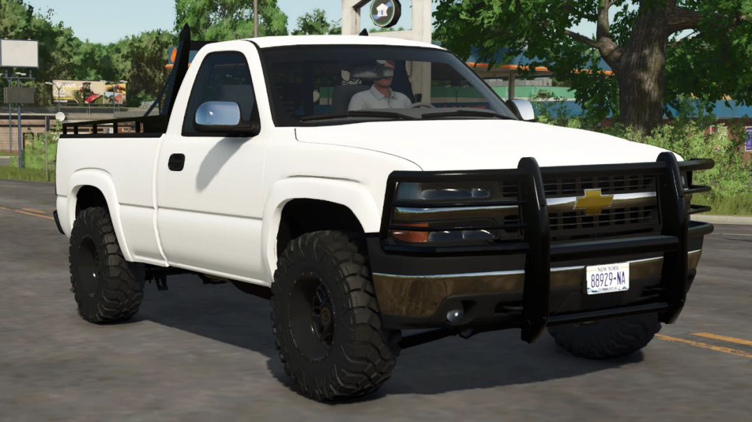 Farming Simulator 25 mods: Chevrolet Silverado 1500 pickup truck with increased off-road tires and front bumper guard.