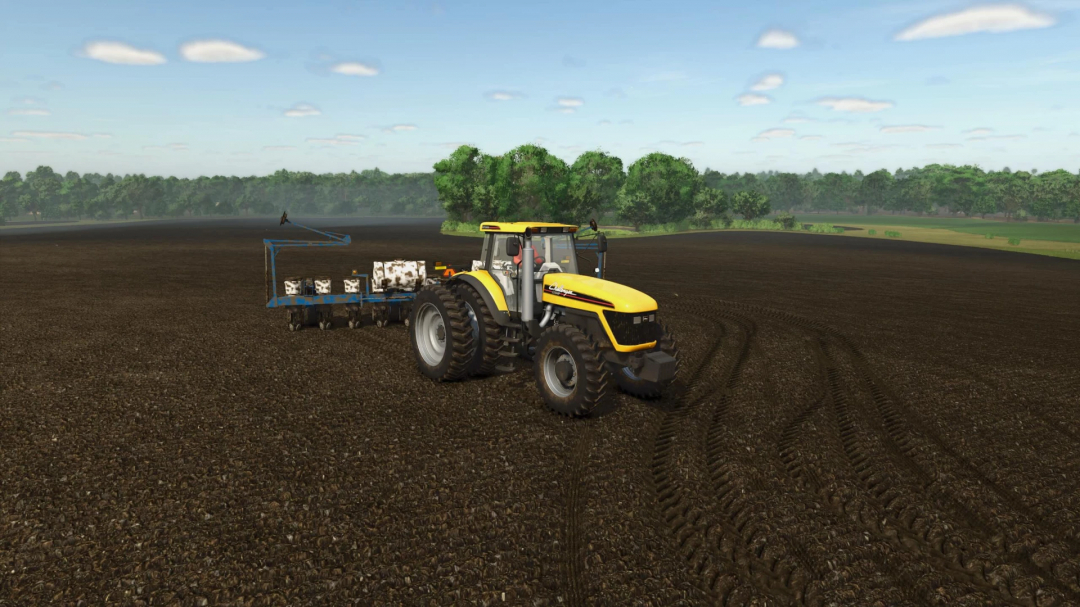 Farming Simulator 25 mod: yellow AGCO Rowcrop Tractors v1.0.0.0 plowing a field with farming equipment in Farming Simulator 25.
