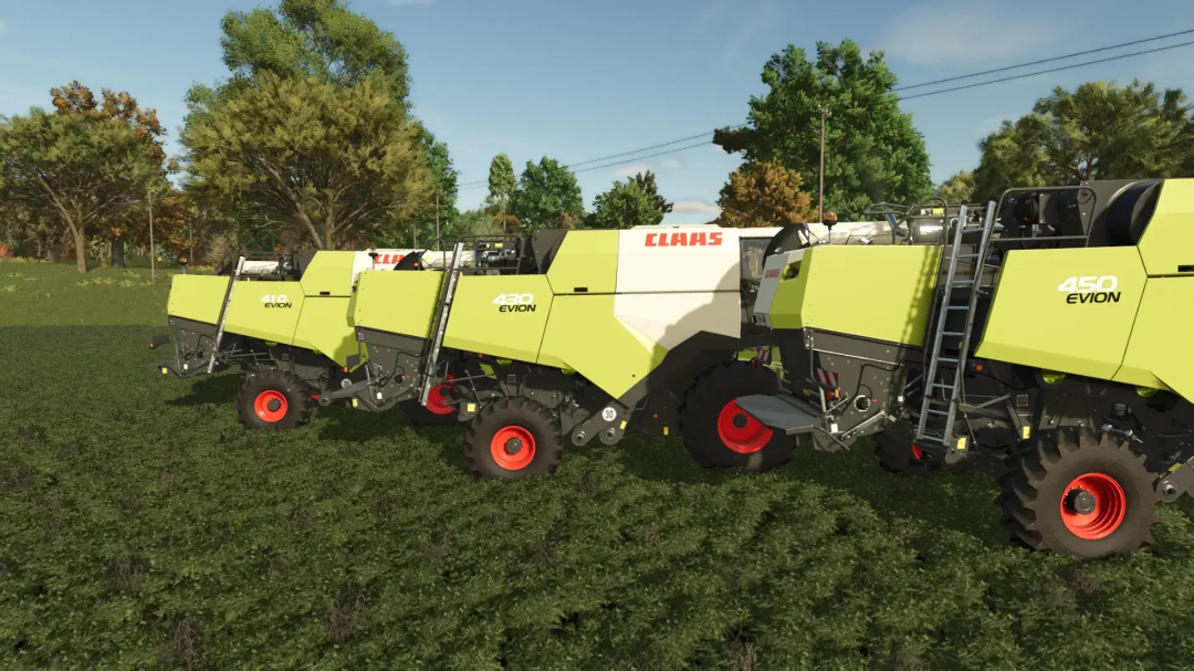 Multiple Claas Evion harvesters in Farming Simulator 25 mods on a grassy field with trees in the background.