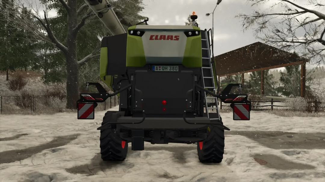 Rear view of a CLAAS tractor from the Farming Simulator 25 CLAAS Trion 720-750 Pack mod in a snowy farm environment.