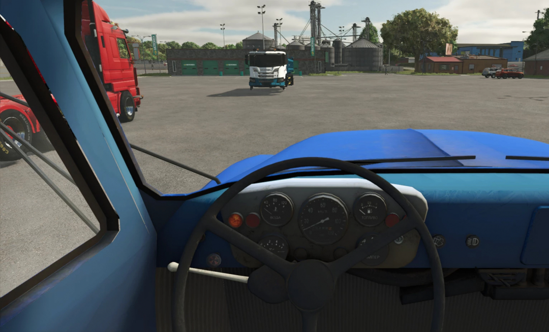 Inside view of a blue FS25 mod truck in Farming Simulator 25, with other trucks and farm buildings in the background.