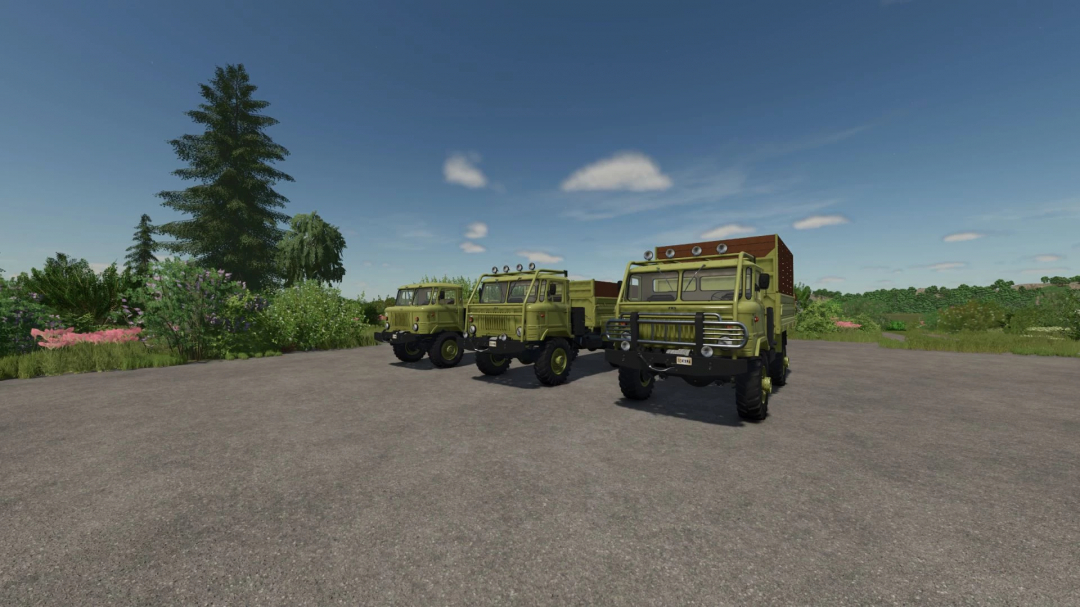 Three vintage military trucks from the GAZ 66 Pack mod in Farming Simulator 25, parked on a gravel lot with green landscape and blue sky.