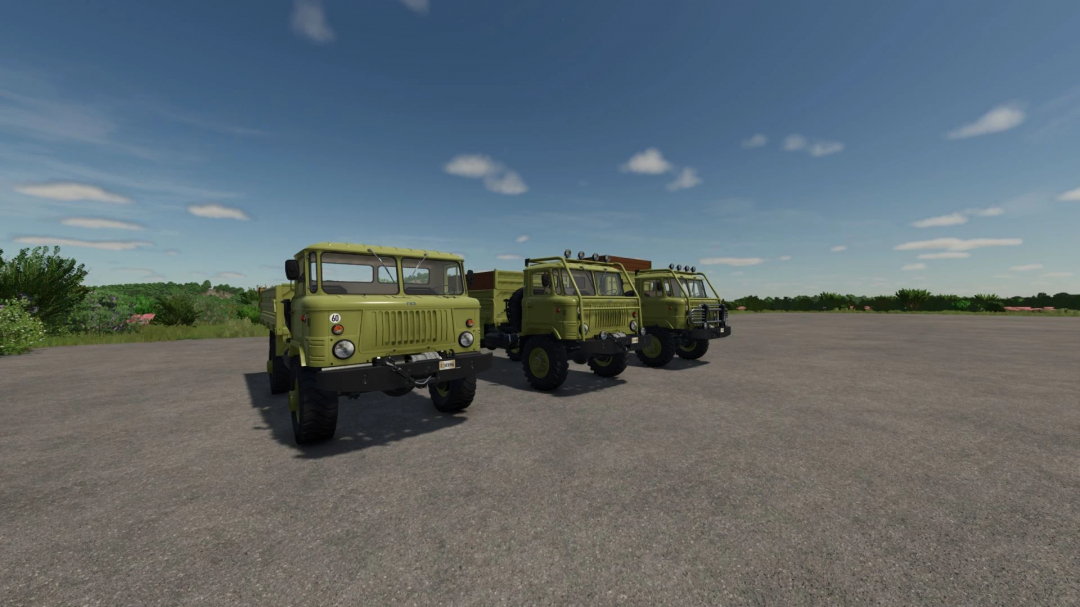 Farming Simulator 25 mods: GAZ 66 Pack v1.0.0.0 trucks in a row on a gravel field under a blue sky.