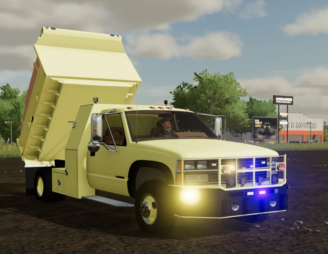 Farming Simulator 22 mod: GMT400 Dumptruck ND v1.0.0.0, yellow dump truck with raised bed, driving on dirt road, in-game scene.