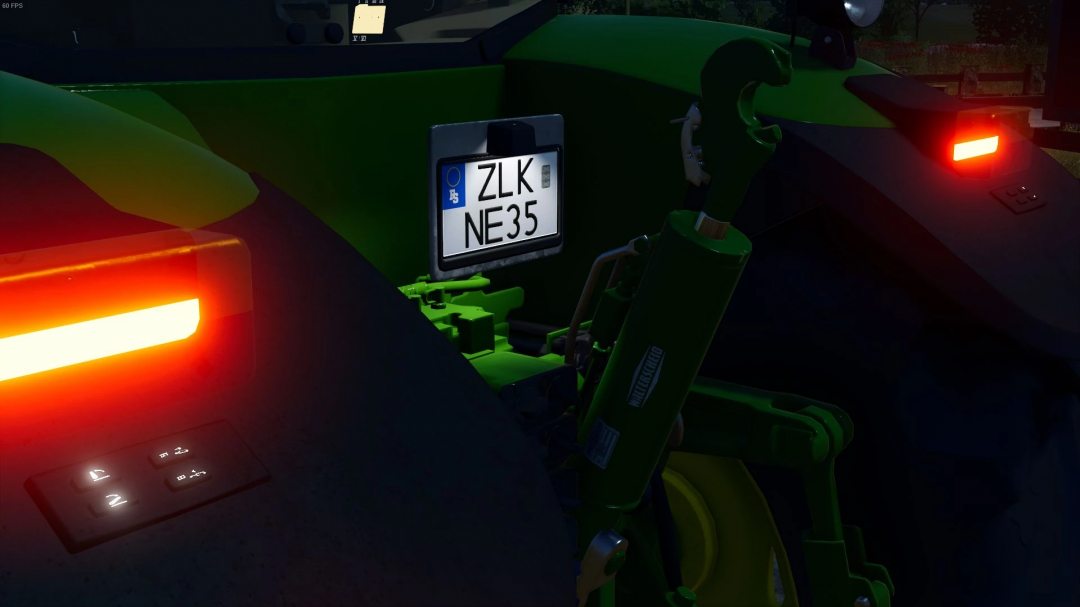 Close-up of a green John Deere tractor dashboard in Farming Simulator 25, featuring a German license plate and illuminated controls, FS25 mod.