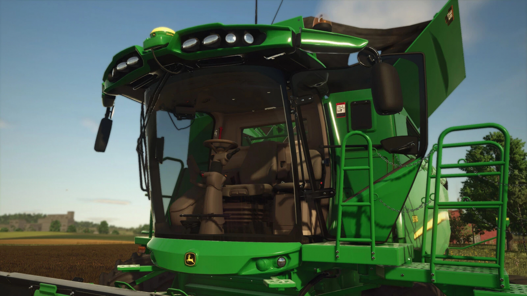 John Deere S600 Series agricultural harvester in Farming Simulator 25, showcasing its green cab and detailed interior.