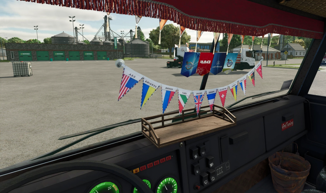 Interior of a truck from Farming Simulator 25 with decorative flags and banners, showcasing FS25 mods.