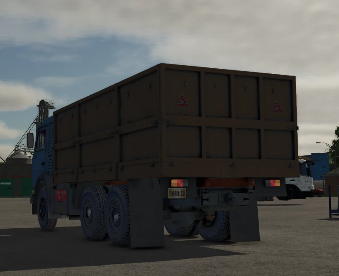Farming Simulator 25 mod: KamAZ 5320 truck with a brown cargo bed, viewed from the rear in a virtual farm environment.