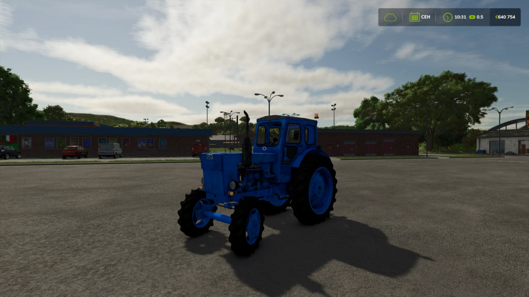 Farming Simulator 25 mod: Blue LTZ 40 tractor from FS25 mods, shown in an outdoor parking lot scene.