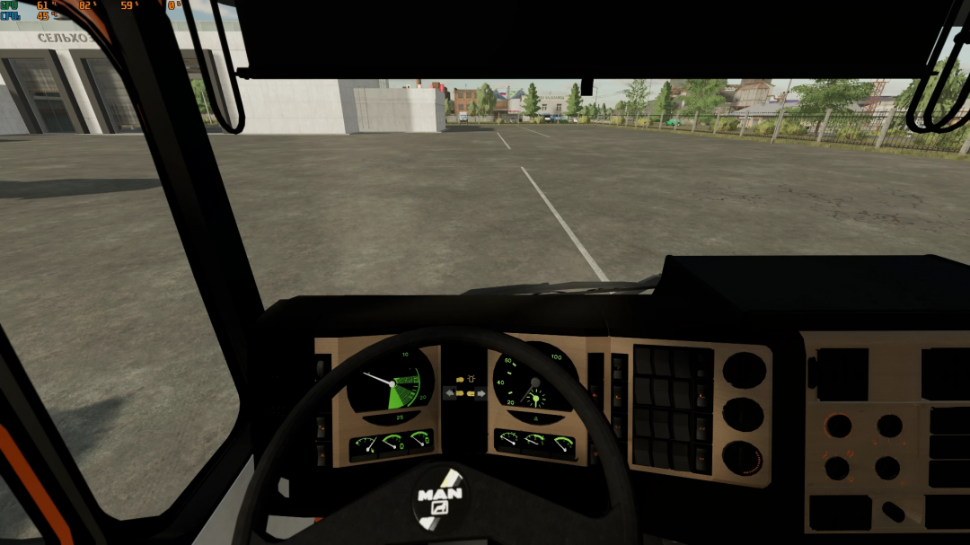 Inside view of a MAN 26.372 truck mod in Farming Simulator 22, showing dashboard and empty parking lot outside.