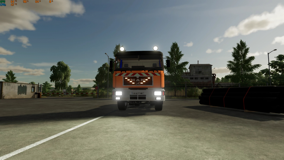 Farming Simulator 22 mod: MAN 26.372 truck with bright headlights parked in industrial yard, under a partly cloudy sky.