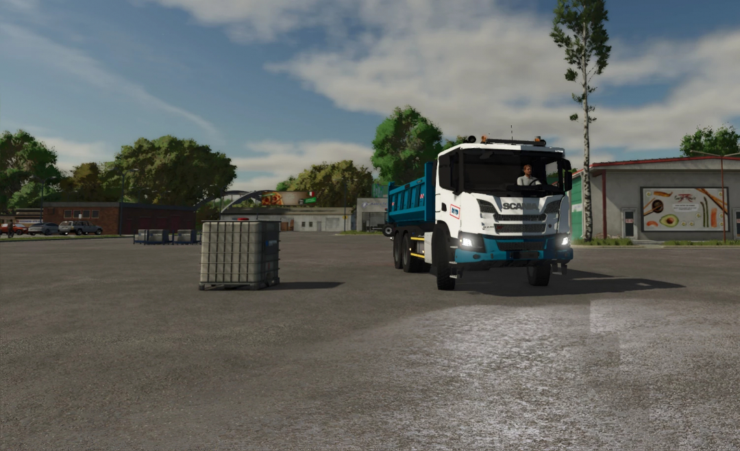 Farming Simulator 25 mod: Scania xt truck in a parking lot, showcasing a detailed mod with a blue body and realistic design.