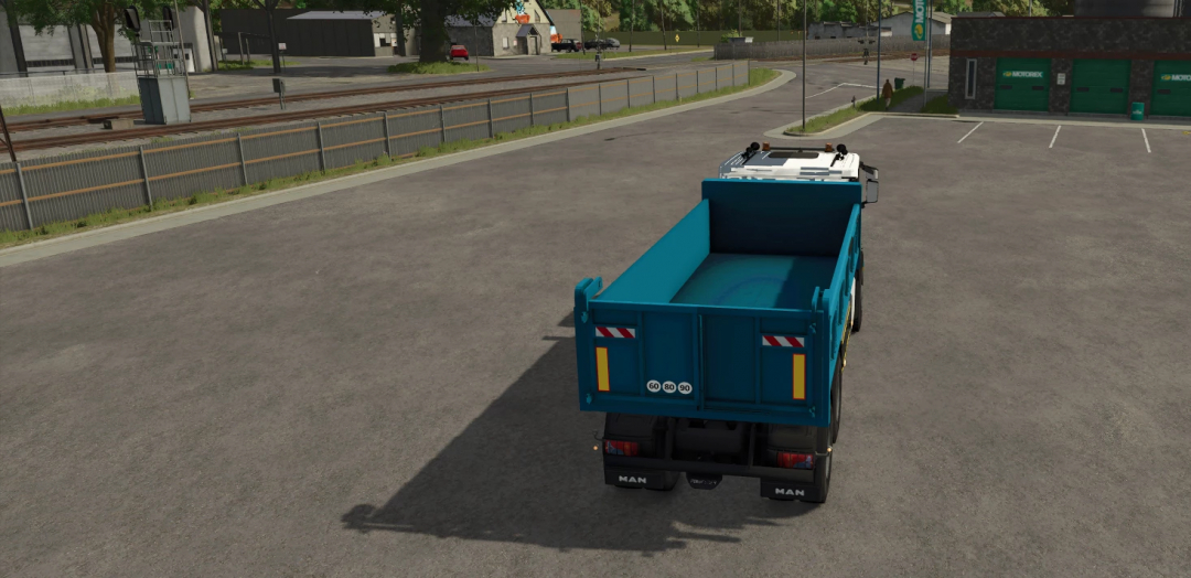 Farming Simulator 25 mod: Blue Scania XT truck parked in a lot, showcasing realistic graphics and vehicle detail.