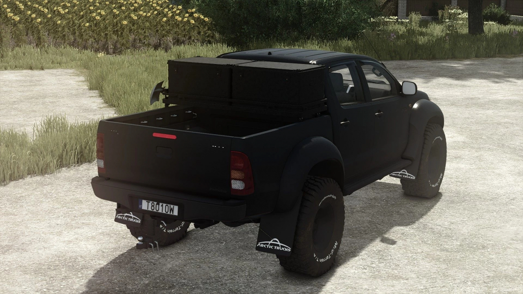 Black pickup truck mod from Farming Simulator 25, featuring Arctic Trucks mud flaps and a roof-mounted storage box, for FS25 mods.