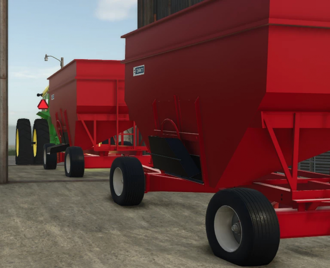 Farming Simulator 25 mods: Turnco Gravity Wagons v1.0.0.0, red grain wagons attached to a tractor in a farm setting.
