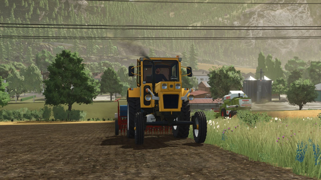 Farming Simulator 25 mods: yellow tractor working on farmland with farming equipment in a rural landscape.