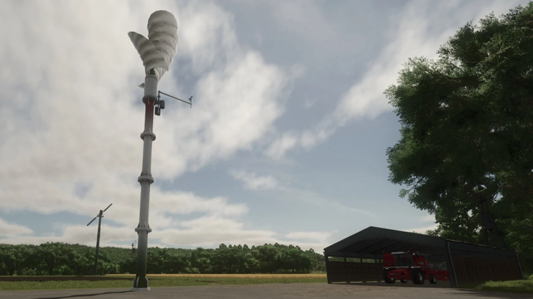 In Farming Simulator 25, a tall vertical wind turbine mod named Lizard H15 v1.0.0.0 stands outdoors beside a shelter with a tractor underneath.