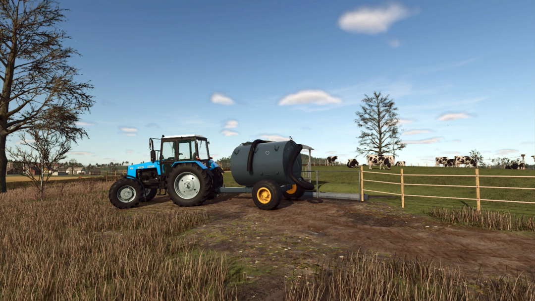 Farming Simulator 25 mod: blue tractor with liquid manure spreader in a farm field next to cows and trees.