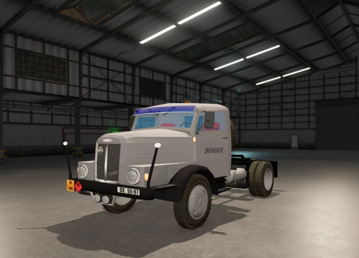 fs25-mods, Farming Simulator 25 mod: IFA S4000 truck in a warehouse, detailed with DÜNGER branding, realistic lighting, and vehicle accessories.