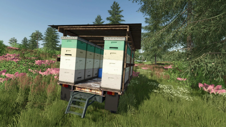 fs25-mods,  FS25 mod: Old trailer with beehives for Farming Simulator 25, parked in a grassy field with trees and pink flowers.