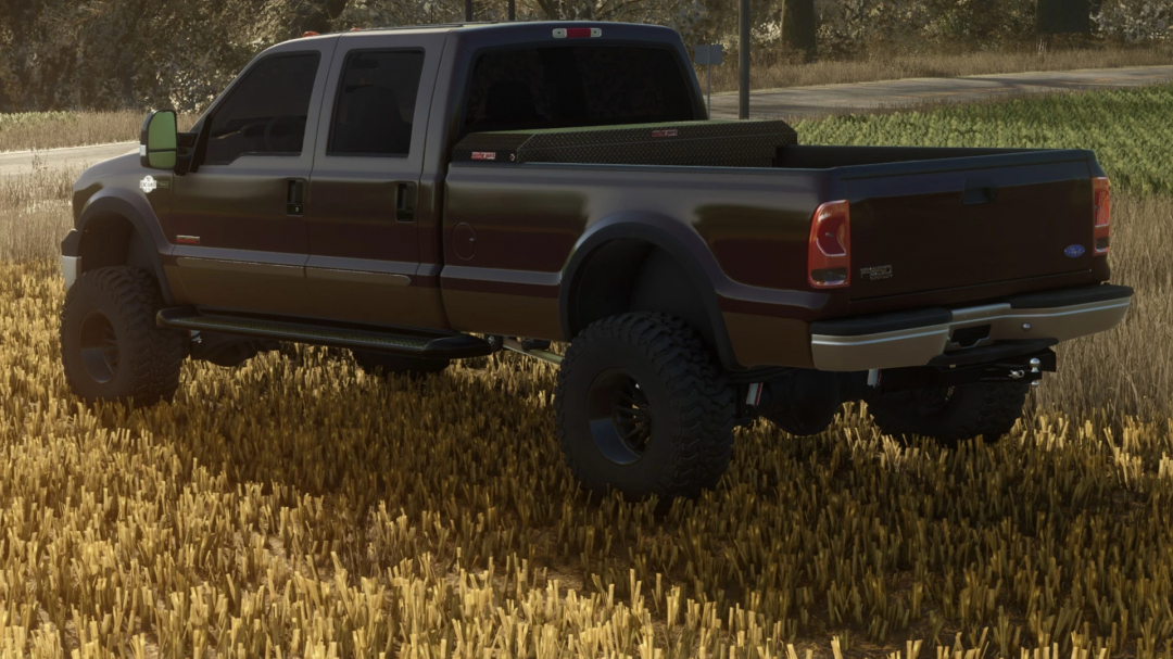 In-game image of a modified Ford F-350 pickup truck for Farming Simulator 25, showing a dark-colored truck with off-road tires on a field.