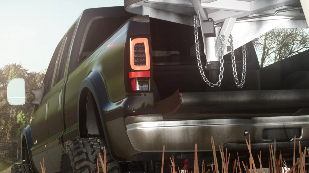 Farming Simulator 25 mod featuring a detailed green pickup truck with chains in the truck bed, showcasing the 1999-2007 Ford F-350 v1.0.0.0 mod.