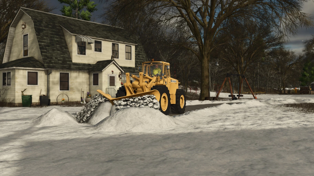Farming Simulator 25 mods: Volvo snow plow clearing snow in winter at a residential house, with a swing set nearby.