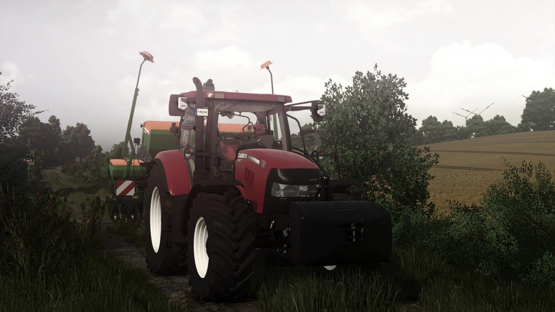 Farming Simulator 25 mod: Case IH Maxxum tractor with front weights and trailer, in a rural field setting.