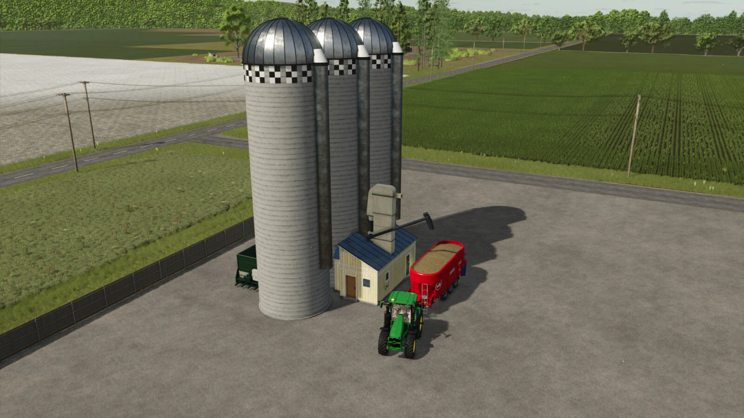 Farming Simulator 25 mod: Central Ethanol and Feed storage silos with a tractor, feed trailer, and small building.