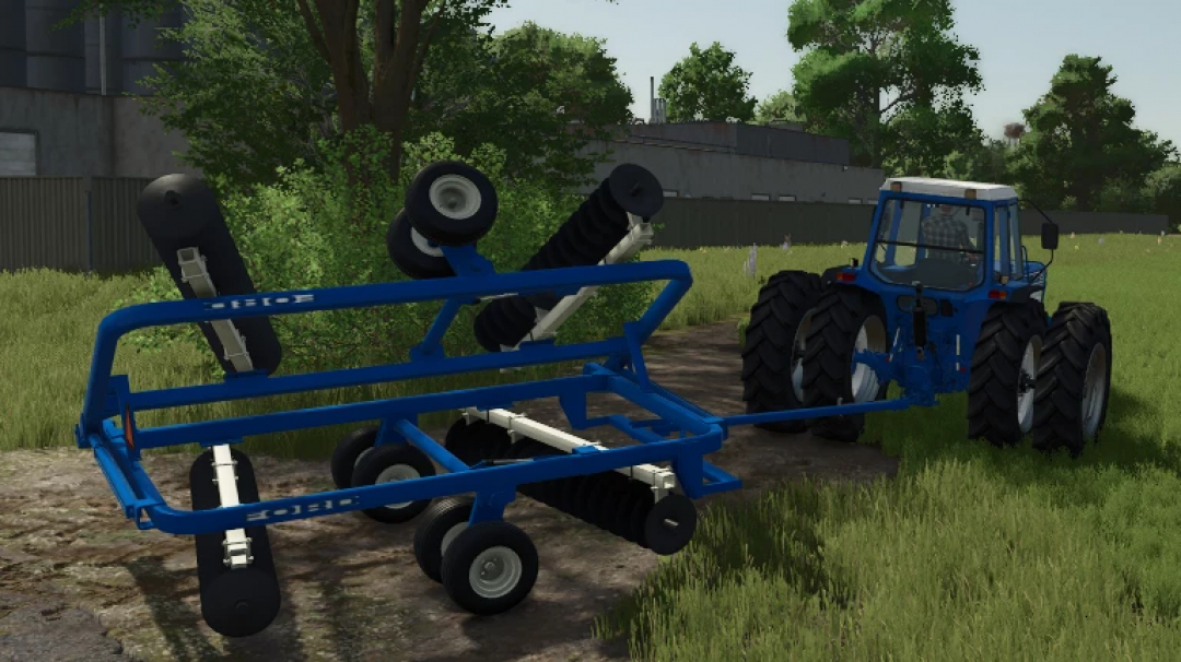 Farming Simulator 25 mods: Blue disc harrow attached to a tractor in a rural field environment.