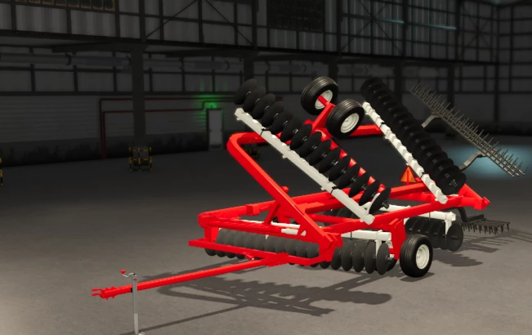 FS25 IH Disc mod displayed inside a farming equipment storage, featuring a red frame with black disc blades for Farming Simulator 25.