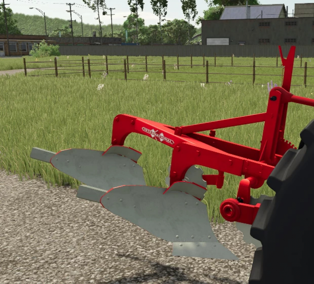 Farming Simulator 25 mod: Red International Plow attached to a tractor on a farm field.