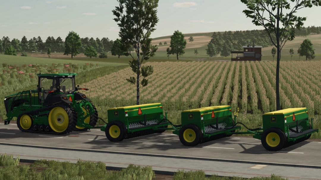 Farming Simulator 25 mods featuring a John Deere 8350 tractor with three seeders attached, on a rural road with farmland in the background.