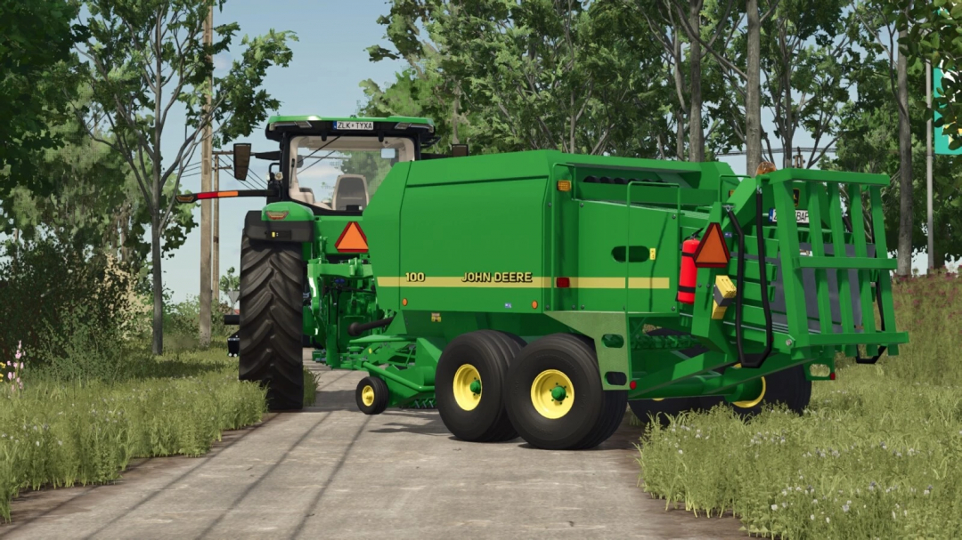 John Deere bale wrapper mod in Farming Simulator 25, shown on a farm road with trees and grass, part of FS25 mods.