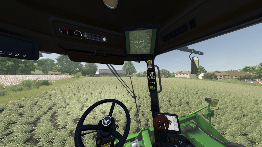 Inside view of a Farming Simulator 25 mod, John Deere CP690 Edit v1.0.0.0, showing dashboard and map in the tractor cabin.