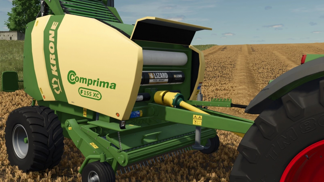 Farming Simulator 25 mod: Krone Comprima F155 XC round baler in a field, used for hay and straw baling, with green and yellow colors.