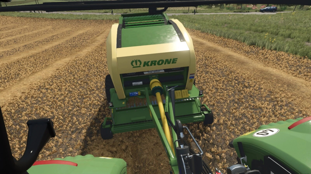 Farming Simulator 25 mod: Krone Comprima F155 XC hay baler working in a field, with visible branding and tractor attachments.