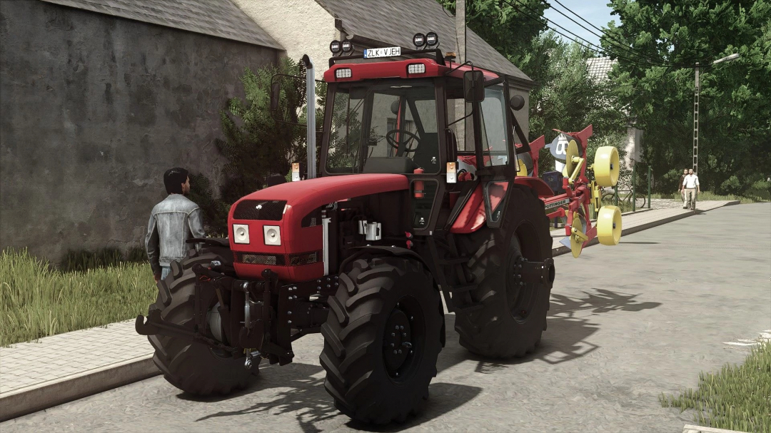 Farming Simulator 25 mod MTZ 1025.3 v1.2.0.0 tractor on road with farming equipment in the background.