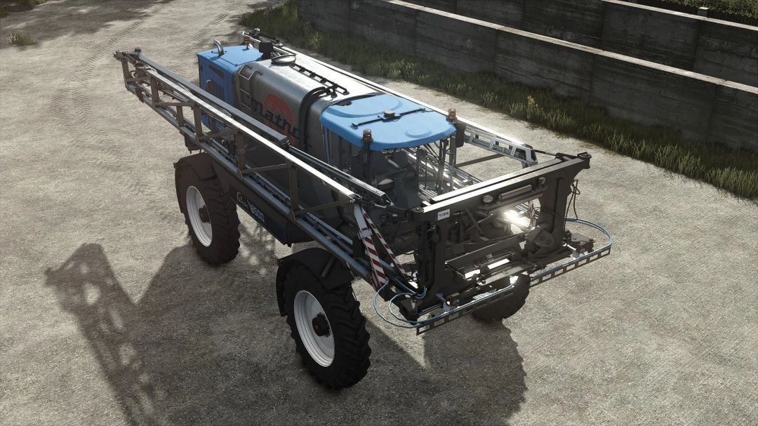 Farming Simulator 25 mod: Matrot Falcon 8500 spray equipment with blue cab, mounted on large tires in an outdoor farm setting.