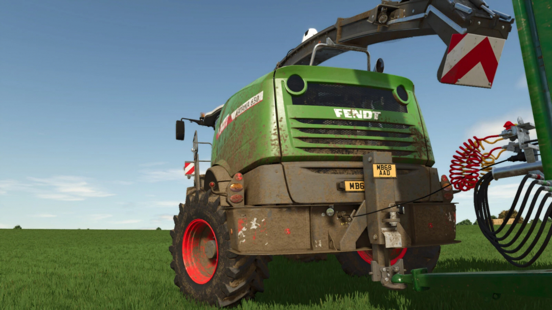 Farming Simulator 25 mod featuring a green Fendt tractor with mud-covered tires connected to a pickup hitch for foragers, part of FS25 mods collection.